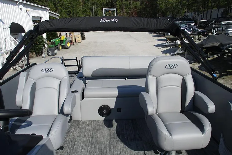 Slide: The Image of 2026 Bentley Pontoons Legacy 220 Swingback interior with luxurious seating and sleek design. - 20