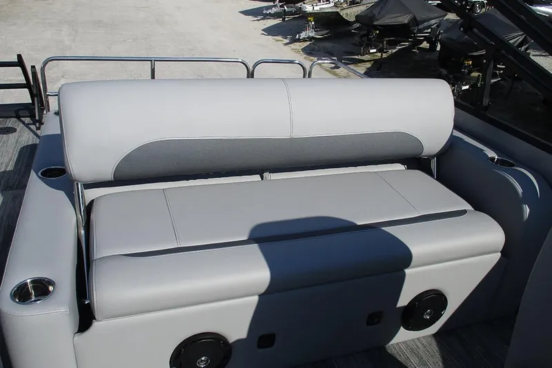 Slide: The Image of 2026 Bentley Pontoons Legacy 220 Swingback with sleek gray seating and cup holders. - 22