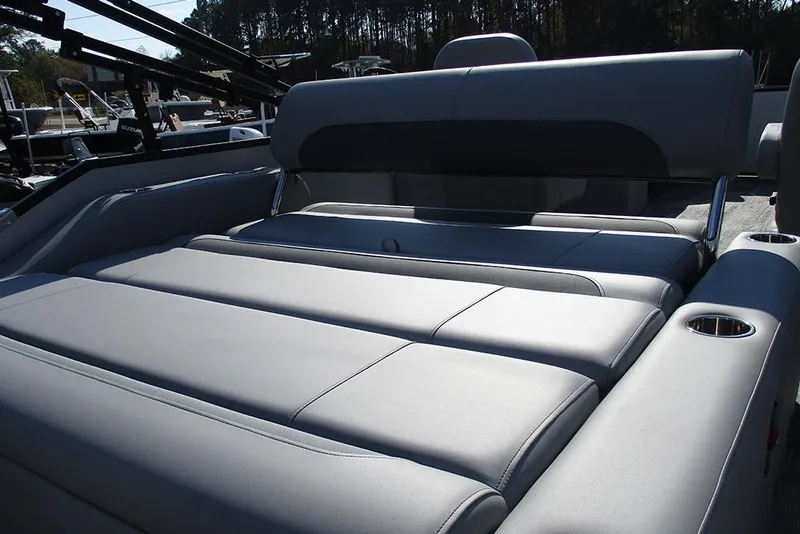 Slide: The Image of 2026 Bentley Pontoons Legacy 220 Swingback with luxurious seating and cup holders. - 24