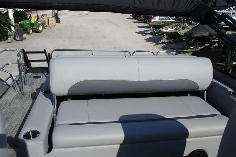 Slide: The Image of 2026 Bentley Pontoons Legacy 220 Swingback with gray seating and cup holders. - 26