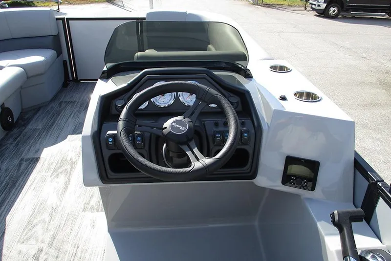 Slide: The Image of 2026 Bentley Pontoons Legacy 220 Swingback dashboard with steering wheel and controls. - 28