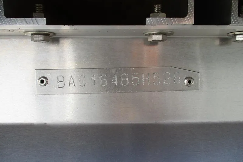 Slide: The Image of Hull identification number on 2026 Bentley Pontoons Legacy 220 Swingback, engraved on metal surface. - 29