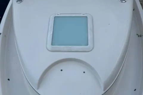 Slide: The Image of 2007 Cobia 270 boat deck with a square hatch. - 16