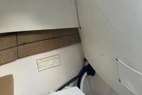 Slide: The Image of 2007 Cobia 270 boat deck with seating and storage compartments. - 20