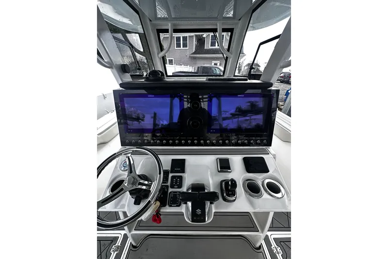 The Image of 2023 Sea Pro 320 DLX Offshore boat dashboard with advanced navigation controls and displays. - 0