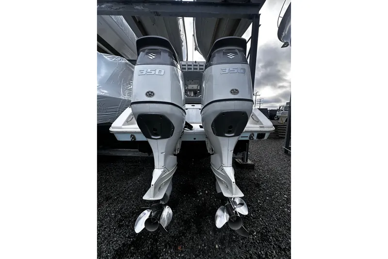 Slide: The Image of 2023 Sea Pro 320 DLX Offshore with dual Suzuki 350 outboard engines. - 10