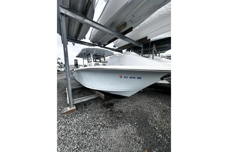 Slide: The Image of 2023 Sea Pro 320 DLX Offshore boat in storage, side view. - 13