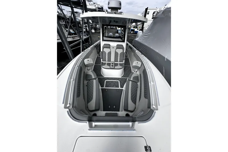 Slide: The Image of 2023 Sea Pro 320 DLX Offshore boat interior with modern seating and sleek design. - 7