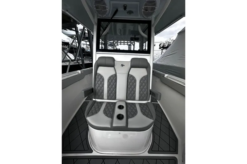 Slide: The Image of 2023 Sea Pro 320 DLX Offshore interior seating with modern design and cup holders. - 9