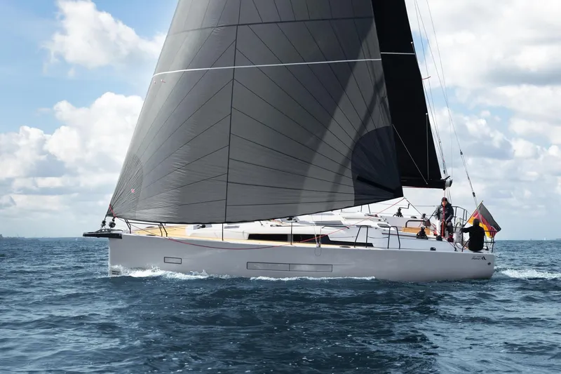 Slide: The Image of 2026 Hanse 360 ST sailboat cruising on open water under clear skies. - 5