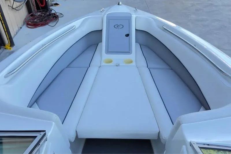 Slide: The Image of Interior view of a 1998 Cobalt 220 boat with white cushioned seating. - 3