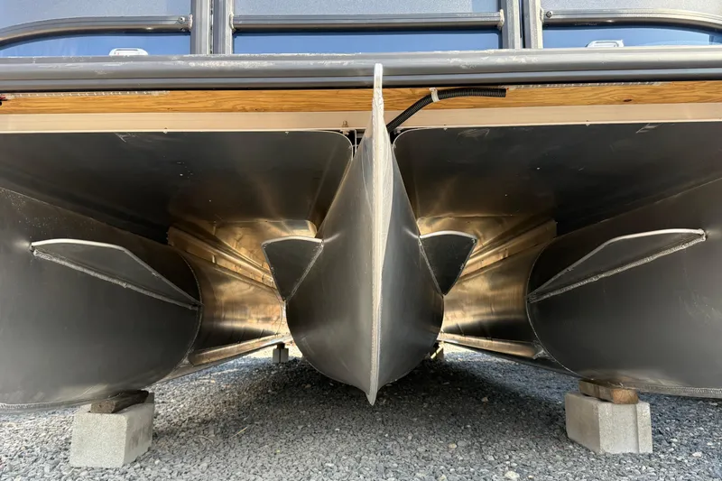 Slide: The Image of Underneath view of 2026 Bentley Pontoons Legacy 243 Swingback, showcasing pontoon structure. - 17