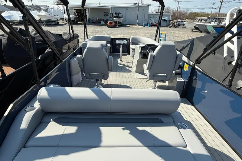 Slide: The Image of 2026 Bentley Pontoons Legacy 243 Swingback interior with luxurious seating and table. - 6