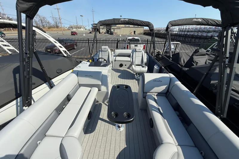 Slide: The Image of 2026 Bentley Pontoons Legacy 243 Swingback interior with luxurious seating and modern design. - 7