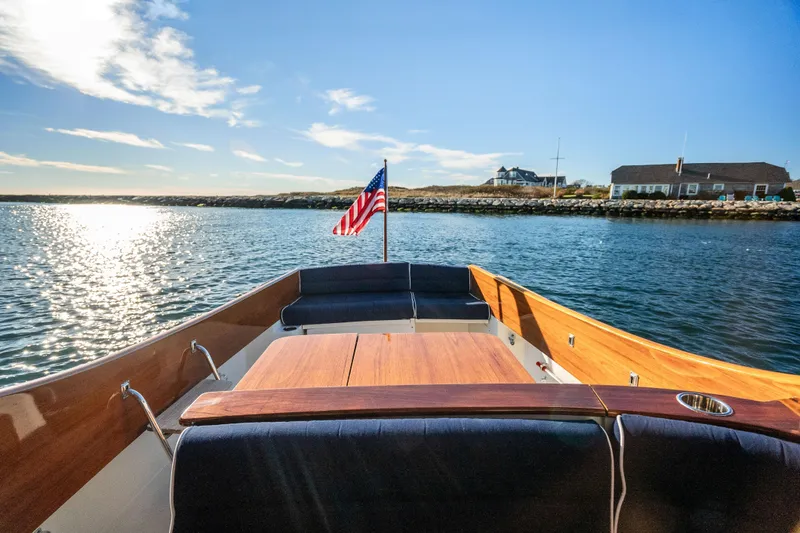 Slide: The Image of 2007 Hinckley Picnic Boat 36 EP cruising on sunny waters with American flag. - 7