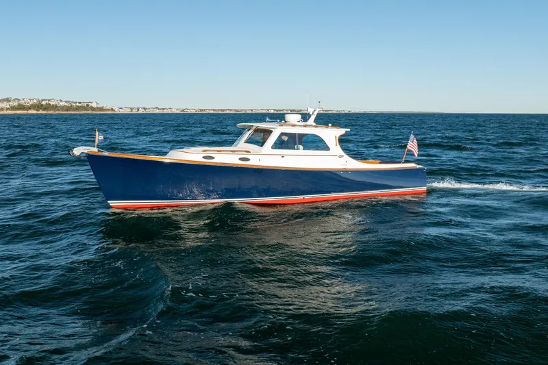 The Image of 2007 Hinckley Picnic Boat 36 EP cruising on open water. - 1