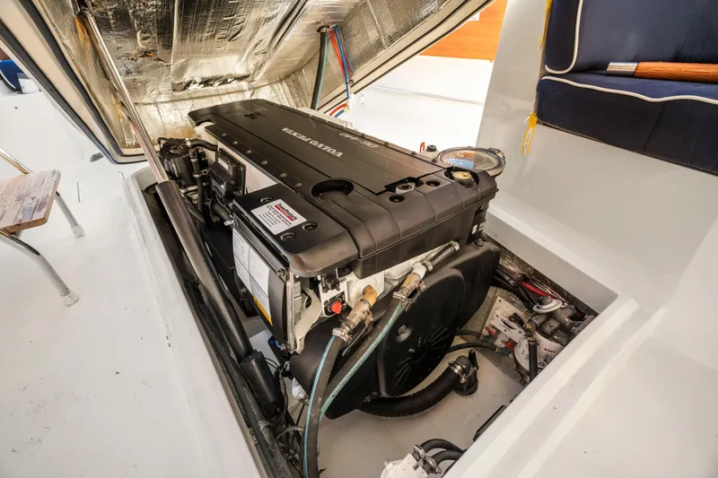 Slide: The Image of Engine compartment of a 2007 Hinckley Picnic Boat 36 EP, featuring a Volvo Penta engine. - 22