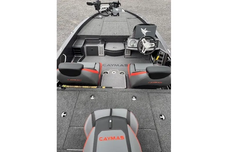Slide: The Image of 2026 Caymas CX 19 PRO boat interior with steering wheel and seating. - 5