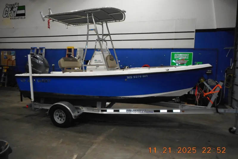 The Image of 2022 Key West 1720 Center Console boat on trailer in indoor storage. - 0