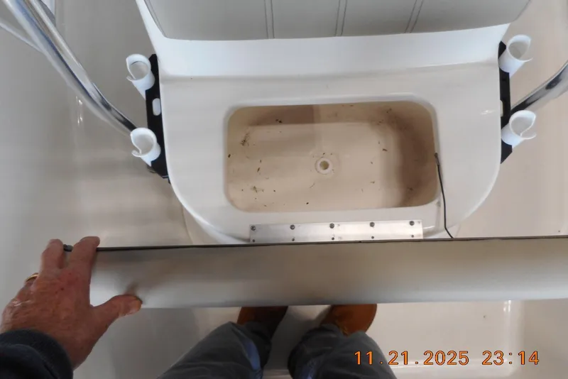 Slide: The Image of 2022 Key West 1720 Center Console boat interior with rod holders and storage compartment. - 18