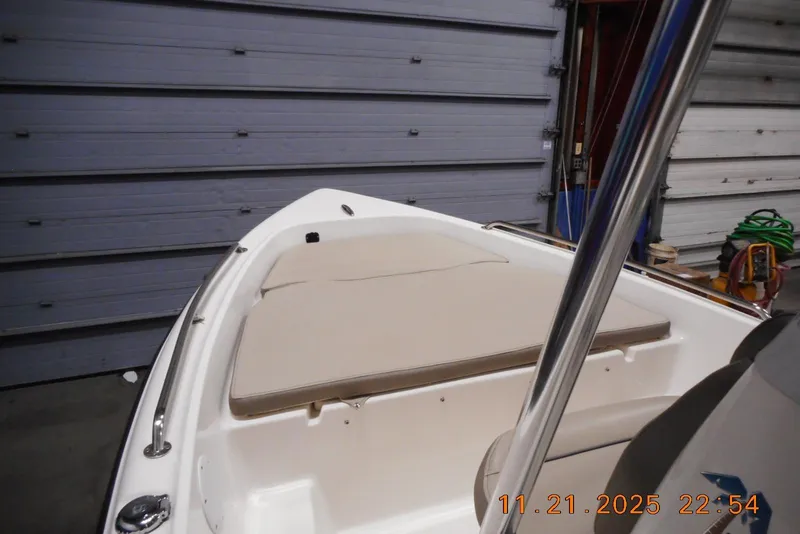 Slide: The Image of 2022 Key West 1720 Center Console boat in a garage setting. - 4
