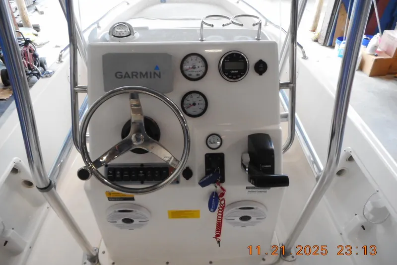 Slide: The Image of Key West 1720 Center Console 2022 boat dashboard with Garmin navigation system. - 5