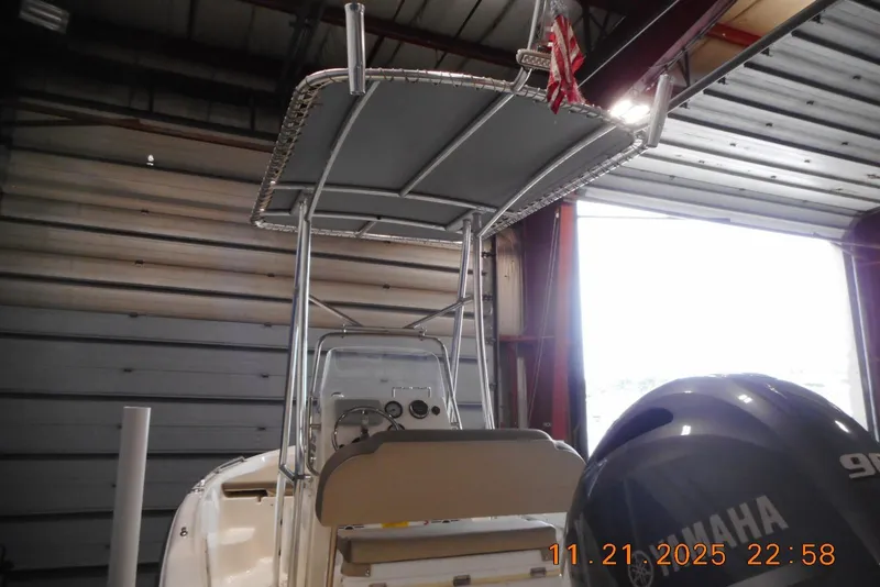 Slide: The Image of 2022 Key West 1720 Center Console boat with Yamaha engine in a garage. - 7