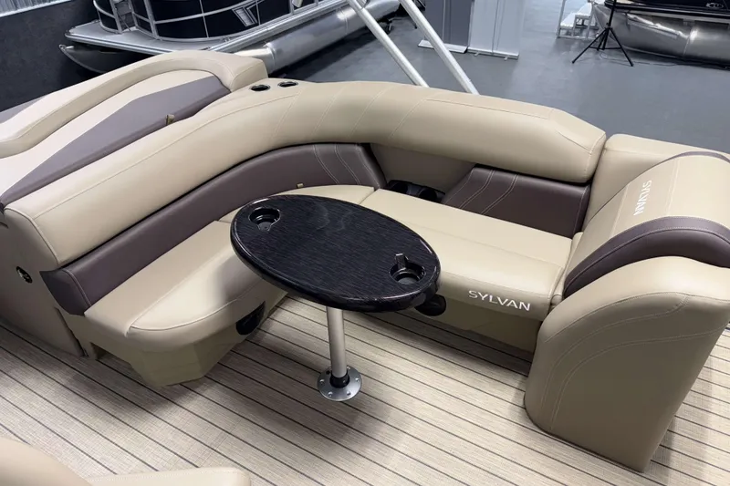 Slide: The Image of Luxurious seating area on 2026 Sylvan Mirage 8520 Cruise pontoon boat with sleek table design. - 11