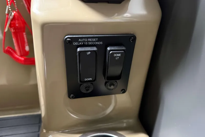 Slide: The Image of Control panel of 2026 Sylvan Mirage 8520 Cruise with auto reset switch. - 13