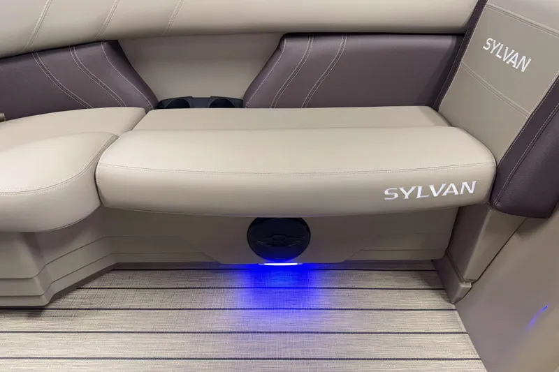 Slide: The Image of 2026 Sylvan Mirage 8520 Cruise interior with beige seating and blue LED lighting. - 15