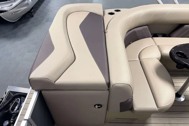 Slide: The Image of Luxurious seating on 2026 Sylvan Mirage 8520 Cruise pontoon boat with beige and brown upholstery. - 16