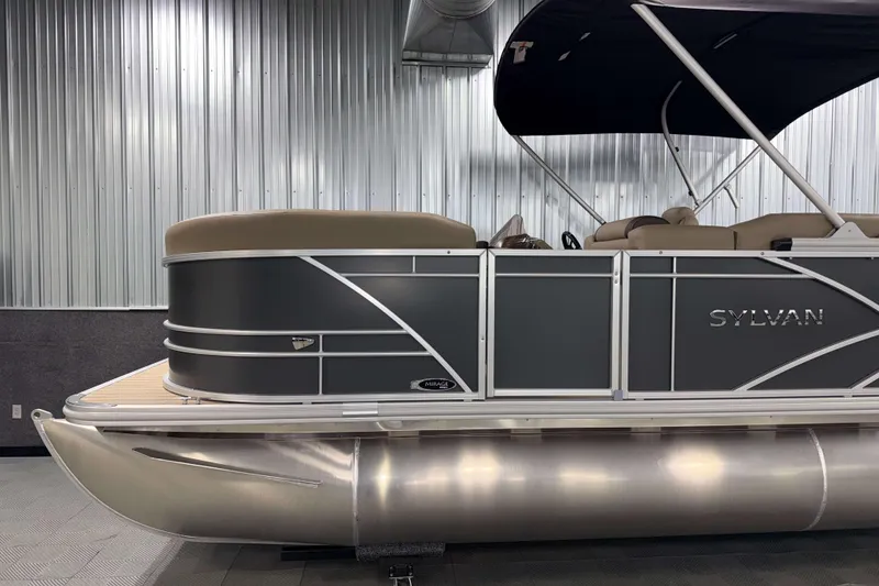 Slide: The Image of 2026 Sylvan Mirage 8520 Cruise pontoon boat in showroom, featuring sleek design and modern amenities. - 20