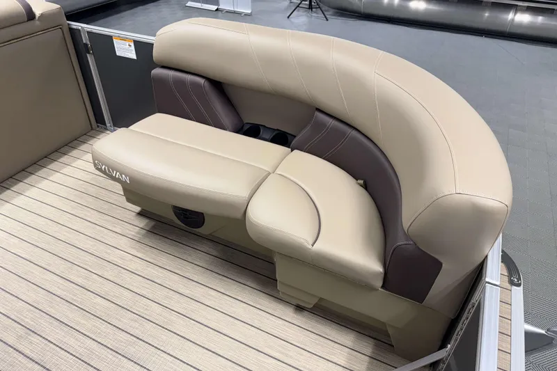 Slide: The Image of 2026 Sylvan Mirage 8520 Cruise boat seating with beige and brown upholstery. - 3