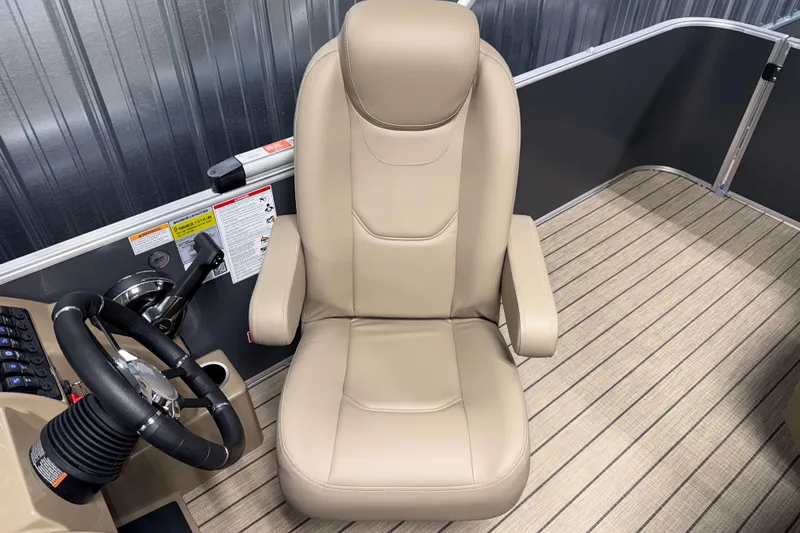 Slide: The Image of Captain's chair and steering wheel of 2026 Sylvan Mirage 8520 Cruise boat. - 8