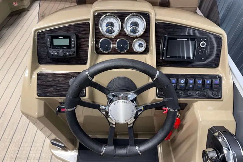 Slide: The Image of 2026 Sylvan Mirage 8520 Cruise dashboard with steering wheel and control panel. - 9