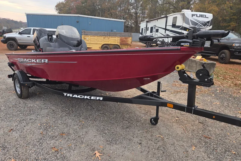 Slide: The Image of 2025 Tracker Super Guide V-16 SC boat on trailer, parked outdoors. - 3