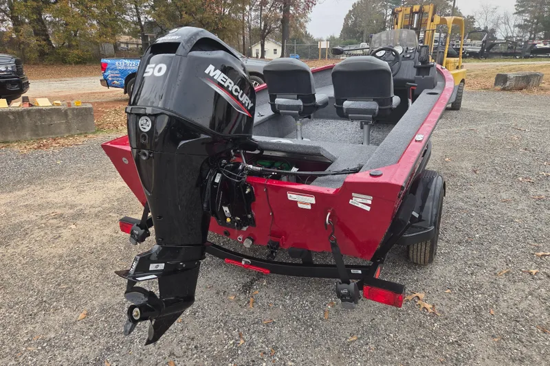 Slide: The Image of 2025 Tracker Super Guide V-16 SC boat with Mercury 50 engine, parked outdoors. - 4
