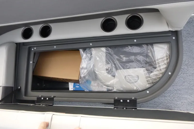 Slide: The Image of Storage compartment in 2026 Sun Tracker Bass Buggy 16 XL Select boat interior. - 14