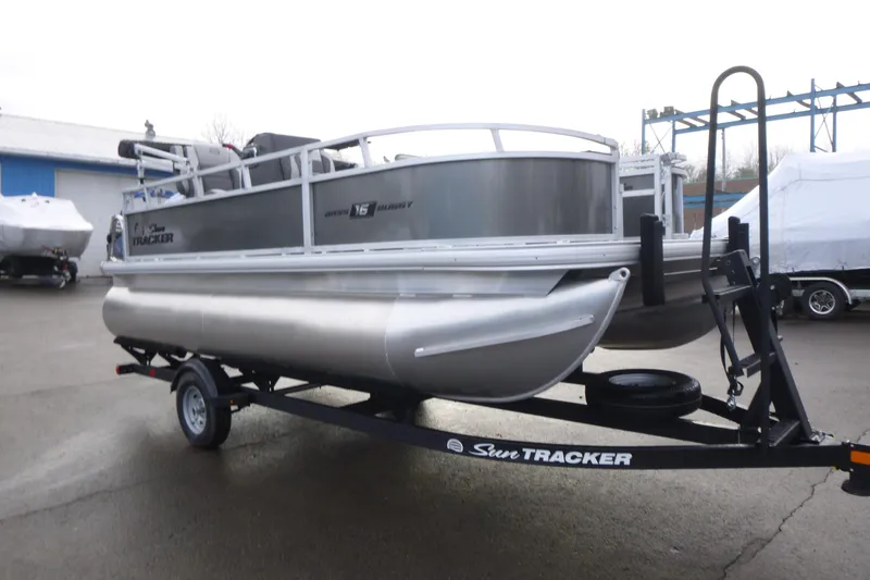 Slide: The Image of 2026 Sun Tracker Bass Buggy 16 XL Select pontoon boat on trailer. - 3