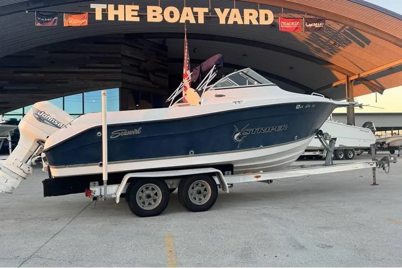 Slide: The Image of 2006 Seaswirl Striper 2101 Dual Console OB on trailer at The Boat Yard. - 6