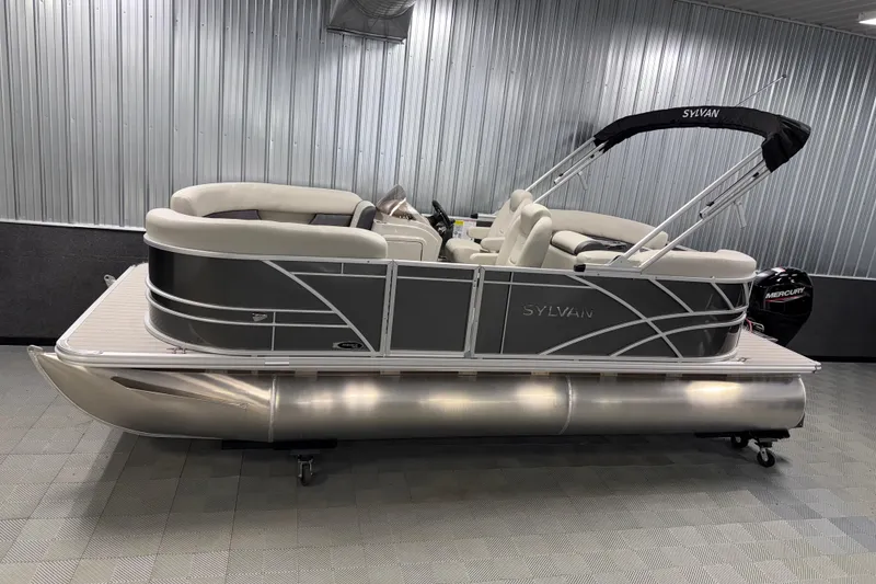 The Image of 2026 Sylvan Mirage 8520 LZ pontoon boat in showroom, featuring sleek design and comfortable seating. - 0