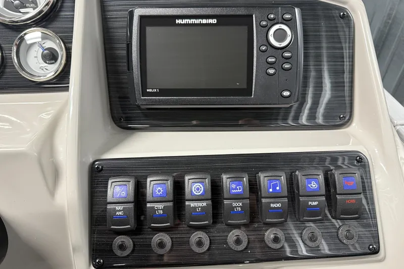 Slide: The Image of Control panel of 2026 Sylvan Mirage 8520 LZ with Humminbird Helix 5 display and switches. - 10