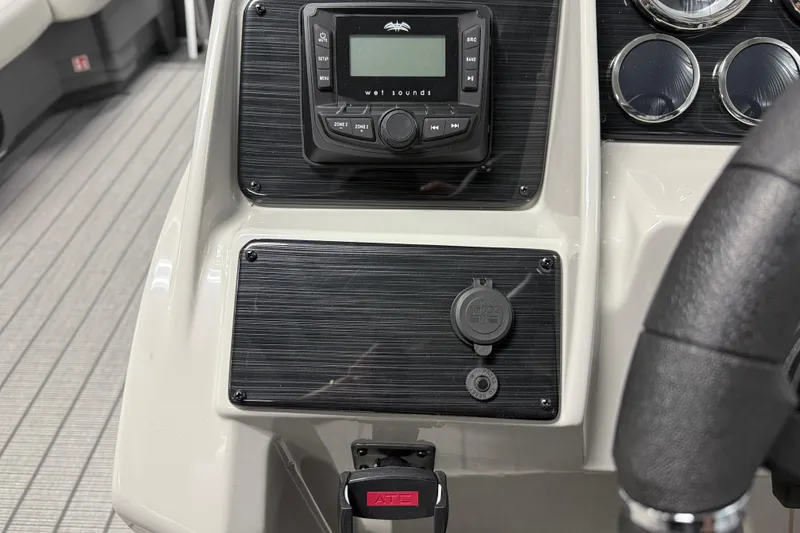 Slide: The Image of Dashboard of 2026 Sylvan Mirage 8520 LZ with audio controls and gauges. - 12
