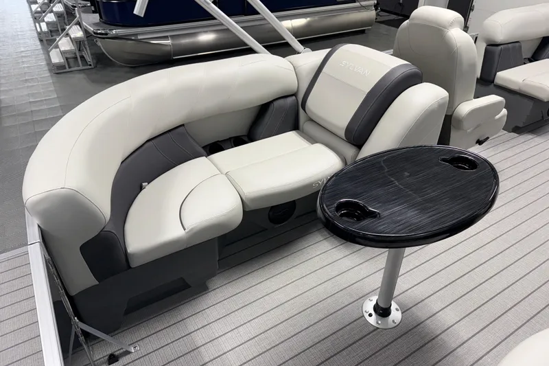 Slide: The Image of Luxurious seating on 2026 Sylvan Mirage 8520 LZ pontoon boat with sleek table design. - 13