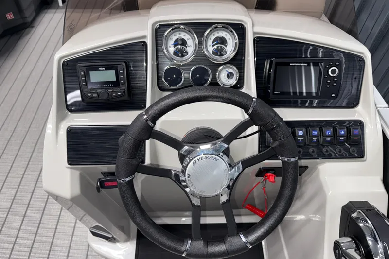 Slide: The Image of Steering console of 2026 Sylvan Mirage 8520 LZ with modern controls and gauges. - 9