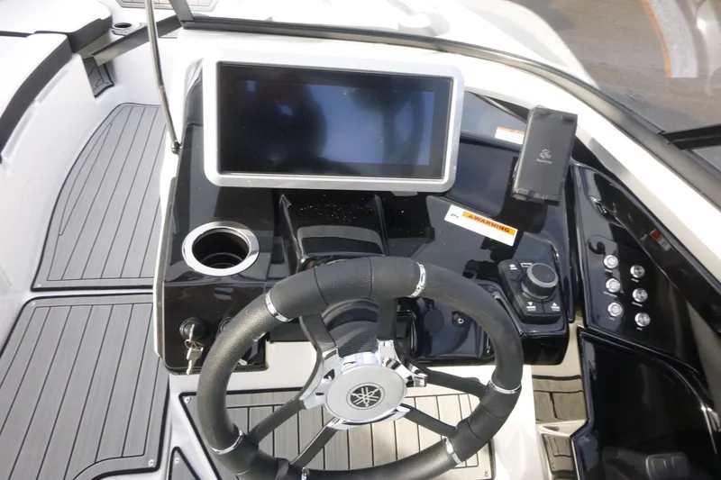 Slide: The Image of 2026 Yamaha Boats 252S dashboard with steering wheel, touchscreen, and control panel. - 12