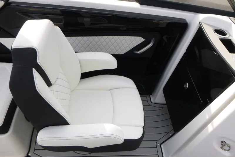 Slide: The Image of Luxurious seating in the 2026 Yamaha Boats 252S, featuring sleek white and black upholstery. - 13