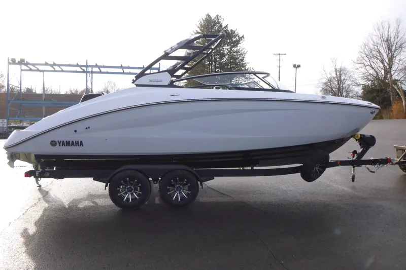 Slide: The Image of 2026 Yamaha Boats 252S on trailer, sleek design, parked outdoors. - 4