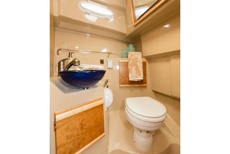 Slide: The Image of Manufacturer Provided Image: 2016 Cutwater 28 boat bathroom with modern sink and toilet. - 14