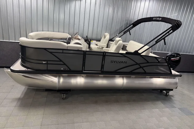 The Image of 2026 Sylvan Mirage 8520 CLZ DH pontoon boat in showroom, featuring sleek design and comfortable seating. - 0